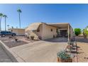 Single-wide manufactured home with carport and landscaped yard at 2650 W Union Hills Dr # 184, Phoenix, AZ 85027
