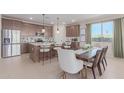 Modern kitchen with island, stainless steel appliances, and ample cabinet space at 18191 W Cielo Grande Ave, Surprise, AZ 85387