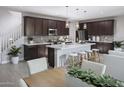 Modern kitchen with island and dark cabinets at 2446 W Rowel Rd, Phoenix, AZ 85085