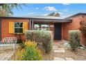 Front view of a charming brick home with well-manicured landscaping at 1539 W Mulberry Dr, Phoenix, AZ 85015