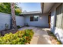 Private patio with flowers and a brick wall at 10423 W Wheatridge Dr, Sun City, AZ 85373