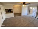 Living room with access to kitchen and patio at 3500 N Hayden Rd # 1903, Scottsdale, AZ 85251