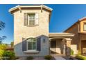 Two-story house with gray siding, stone accents, and a landscaped front yard at 2772 S Betty St, Gilbert, AZ 85295