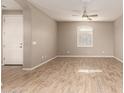 Spacious living room with wood-look tile floors and a ceiling fan at 2772 S Betty St, Gilbert, AZ 85295