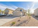 Two-story house with a two-car garage and desert landscaping at 355 W Jersey Way, San Tan Valley, AZ 85143