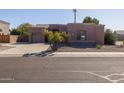 Single-story home with two-car garage and desert landscaping at 3355 E Los Altos Rd, Gilbert, AZ 85297