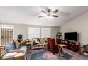 Bright living room with comfy seating and TV at 9431 E Coralbell Ave # 53, Mesa, AZ 85208