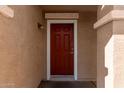 Red front door with white trim at 5014 S 26Th Ln, Phoenix, AZ 85041