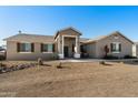 House exterior with desert landscaping at 28480 N Bryce Trl, Queen Creek, AZ 85144