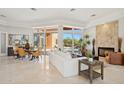 Open living room with fireplace and access to backyard at 23461 N 80Th Way, Scottsdale, AZ 85255