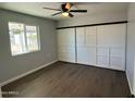 Spacious bedroom with ceiling fan and sliding barn doors at 236 S 2Nd St, Avondale, AZ 85323