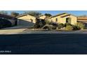 Single-story home with two-car garage and landscaped front yard at 6216 W Hedgehog Pl, Phoenix, AZ 85083
