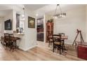 Open concept dining area with kitchen view and breakfast bar at 14950 W Mountain View Blvd # 4205, Surprise, AZ 85374