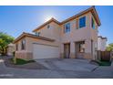 Two-story home with tan exterior and a two-car garage at 7414 S 27Th Way, Phoenix, AZ 85042