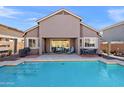 Backyard oasis with a refreshing pool and patio at 2412 W Crimson Ter, Phoenix, AZ 85085