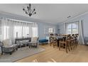 Bright dining room with hardwood floors and bay window at 15912 W Central St, Surprise, AZ 85374