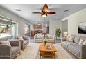 Open concept living room with comfortable seating and kitchen views at 2928 N Congressional Ct, Florence, AZ 85132