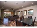 Open living space with hardwood floors and access to patio at 27000 N Alma School Pkwy # 2004, Scottsdale, AZ 85262