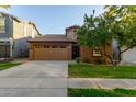 Charming Craftsman home with a two-car garage and manicured lawn at 4337 E Cullumber St, Gilbert, AZ 85234