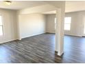 Spacious living room with hardwood floors and large windows at 201 S Apache Ave, Eloy, AZ 85131