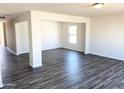 Bright and airy living room featuring hardwood floors at 201 S Apache Ave, Eloy, AZ 85131