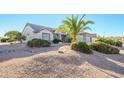 Single story home with attached two car garage and desert landscaping at 18483 N Deer Grass Ct, Surprise, AZ 85374