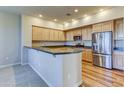 Modern kitchen with stainless steel appliances and light wood cabinets at 20750 N 87Th St # 2062, Scottsdale, AZ 85255