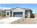 One-story home with gray exterior and blue garage door at 1988 W Cameron Blvd, Coolidge, AZ 85128