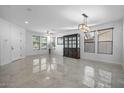 Spacious dining room featuring tile floors and an elegant chandelier at 3535 E Melody Ln, Gilbert, AZ 85234