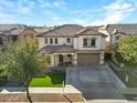 Two-story house with a large driveway and landscaped front yard at 3535 E Melody Ln, Gilbert, AZ 85234