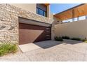 Attached two-car garage with modern wood door at 6311 E Phoenician Blvd # 18, Scottsdale, AZ 85251