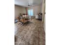 Open concept living and dining area with tile floors at 812 W Saint Anne Ave, Phoenix, AZ 85041