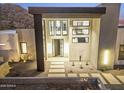 Front entrance of a contemporary home with a sleek design at 9520 S Krista W Dr, Goodyear, AZ 85338