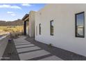 Modern home exterior with a walkway leading to the front entrance at 9520 S Krista W Dr, Goodyear, AZ 85338