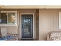 Ornate front door with glass panels adds curb appeal at 10020 W Sandstone Dr, Sun City, AZ 85351