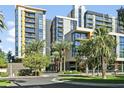 Modern apartment building with palm trees and ample parking at 200 W Portland St # 412, Phoenix, AZ 85003