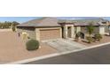 Single story home with a two-car garage and desert landscaping at 41728 W Sagebrush Ct, Maricopa, AZ 85138