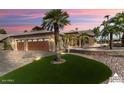 Stunning desert home with three-car garage and manicured lawn at 3507 N Snead Dr, Goodyear, AZ 85395