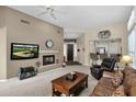 Spacious living room featuring a fireplace and comfortable seating at 6771 E Eagle Feather Rd, Scottsdale, AZ 85266