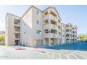 Three-story apartment building with balconies and parking in front at 920 E Devonshire Ave # 2019, Phoenix, AZ 85014
