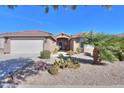 Single-story home with desert landscaping and a two-car garage at 2640 E Golden Trl, Casa Grande, AZ 85194