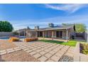 Spacious backyard oasis with a sparkling pool and pergola at 3033 E Sierra St, Phoenix, AZ 85028