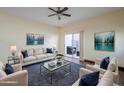 Spacious living room with hardwood floors, neutral colors, and patio access at 5138 W Fulton St, Phoenix, AZ 85043