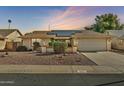 Single-story home with solar panels and well-maintained landscaping at 18903 N 97Th Ln, Peoria, AZ 85382