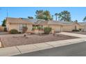 Single-story home with solar panels and desert landscaping at 18903 N 97Th Ln, Peoria, AZ 85382