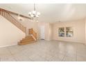 Spacious entryway with tiled floors and staircase at 25575 W Lynne Ln, Buckeye, AZ 85326