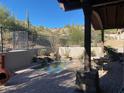 Covered patio with spa, seating area, and mountain views at 27440 N Alma School Pkwy # 116, Scottsdale, AZ 85262