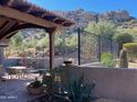 Landscaped patio with mountain views and a spa at 27440 N Alma School Pkwy # 116, Scottsdale, AZ 85262