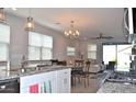 Open concept kitchen and living room with granite countertops at 3722 E Haflinger Rd, San Tan Valley, AZ 85140