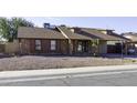 Brick ranch home with carport and mature palm tree at 507 E Judi Dr, Casa Grande, AZ 85122